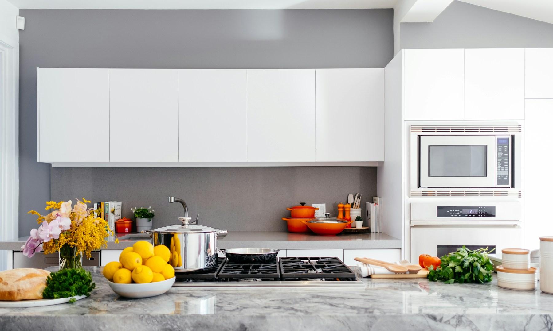 Bright kitchen with colourful cookware and fresh produce